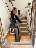 Load image into Gallery viewer, The Black Traveler, a Sleep Crown + Ali Landry + Rivers Eight Collab
